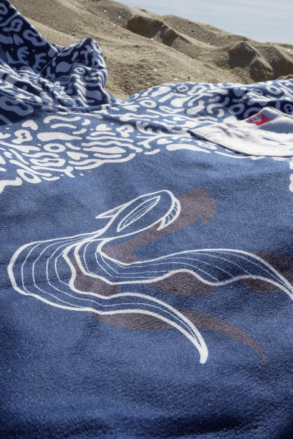 Close-up of the Save La Mermaid x After Essentials poncho design